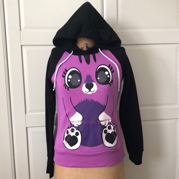 This is a purple cat faced sweater. - Picture 1 of 5